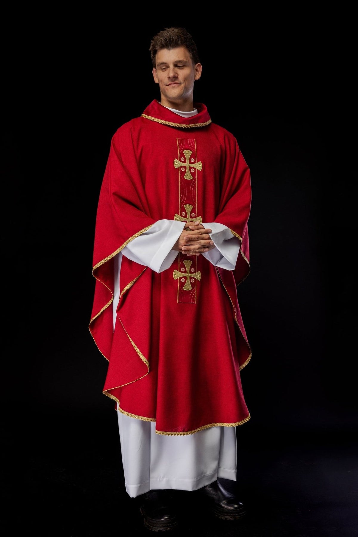 Red chasuble worn, front view with gold cross embroidery