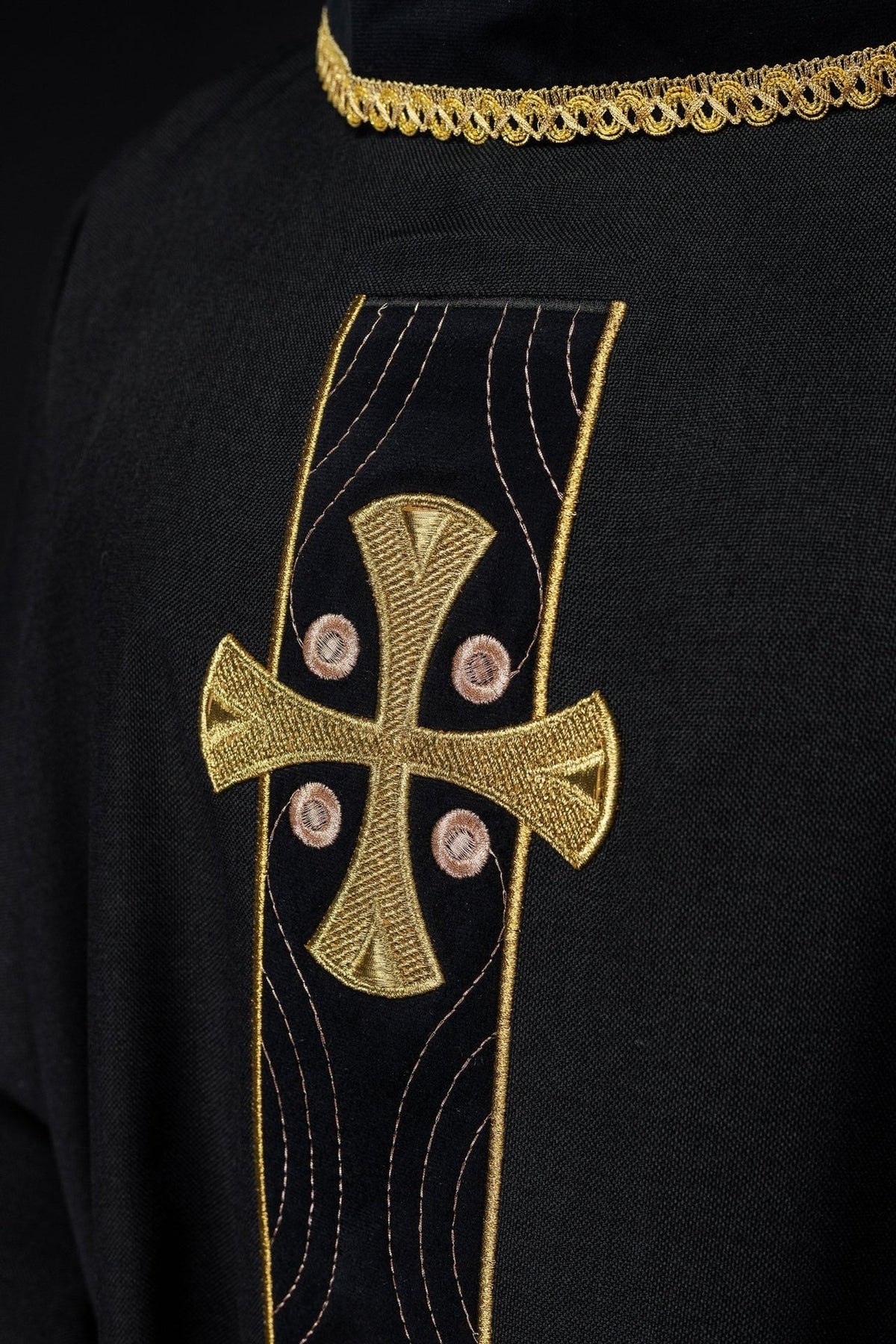 Black chasuble back close-up with gold collar trim