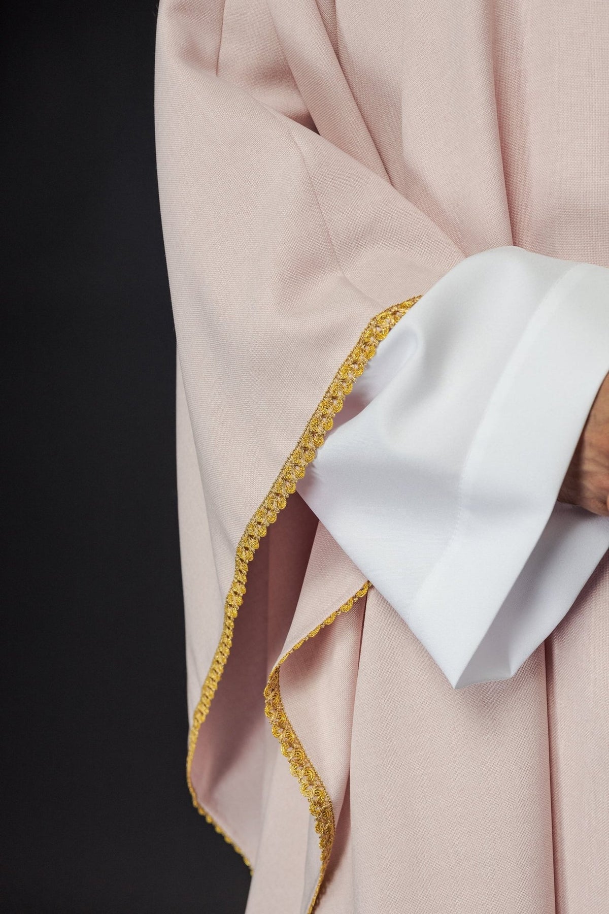 Rose chasuble sleeve close-up with gold trim