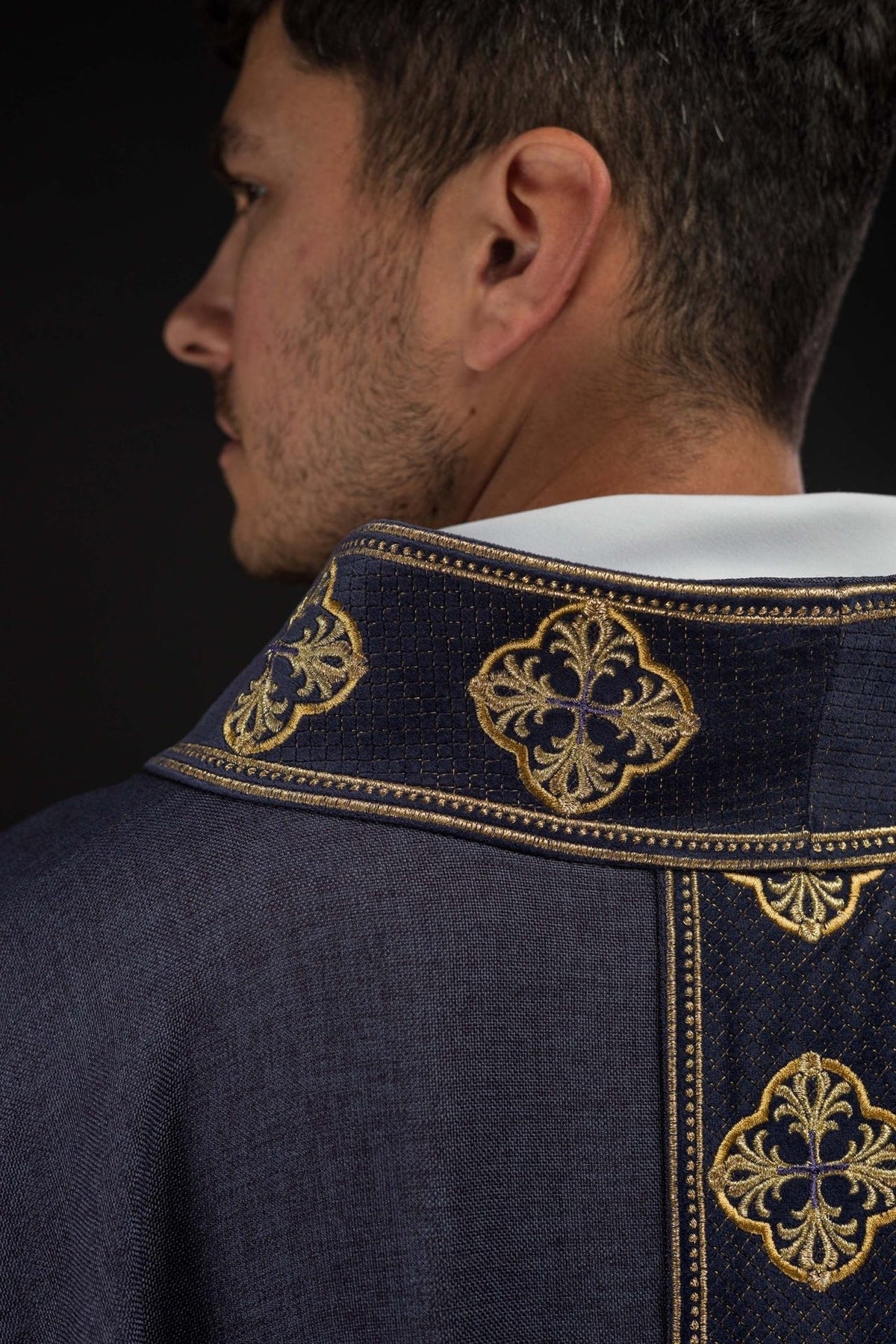 Purple chasuble close-up of embroidered collar with crosses