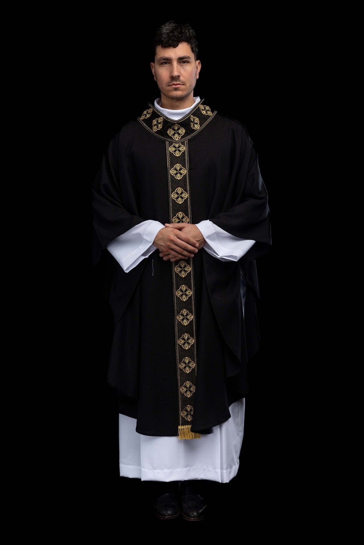Black chasuble front view with gold embroidered orphrey and collar