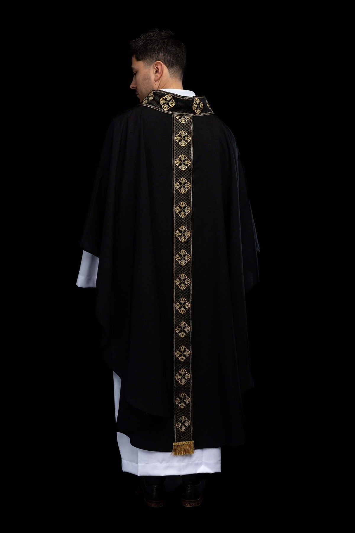 Black chasuble back view with gold embroidered orphrey and collar