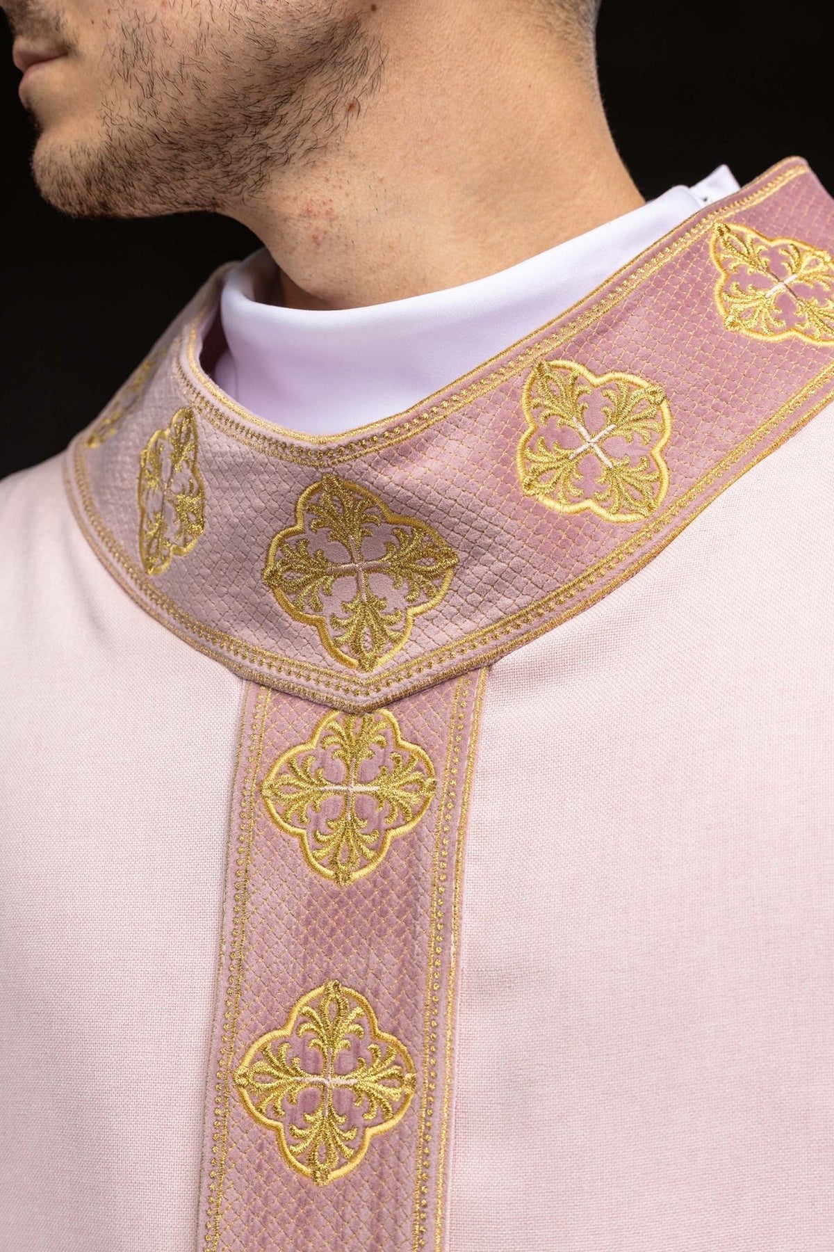 Rose chasuble detail of gold embroidered orphrey and wide sleeves