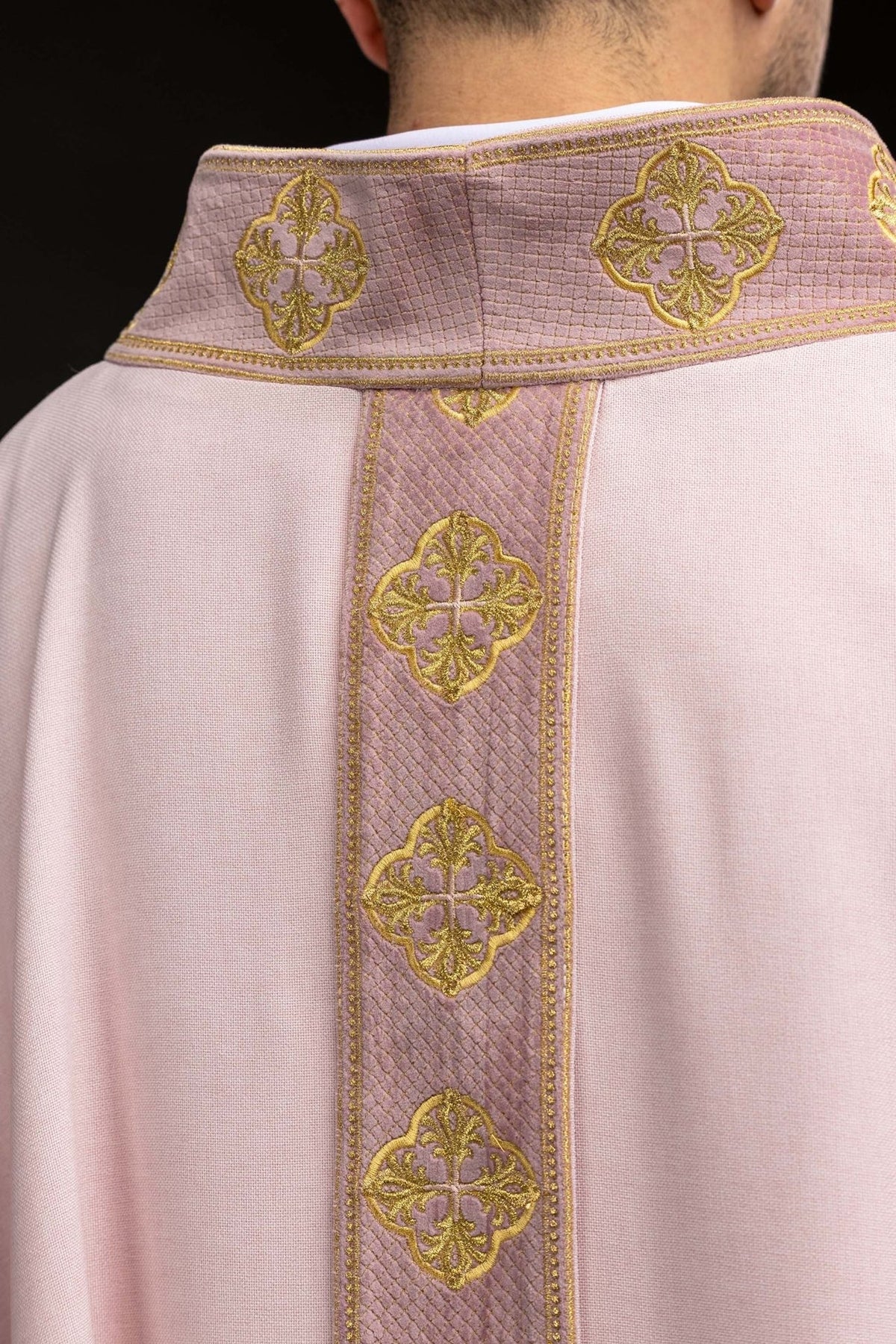 Rose chasuble close-up of collar with gold embroidered crosses