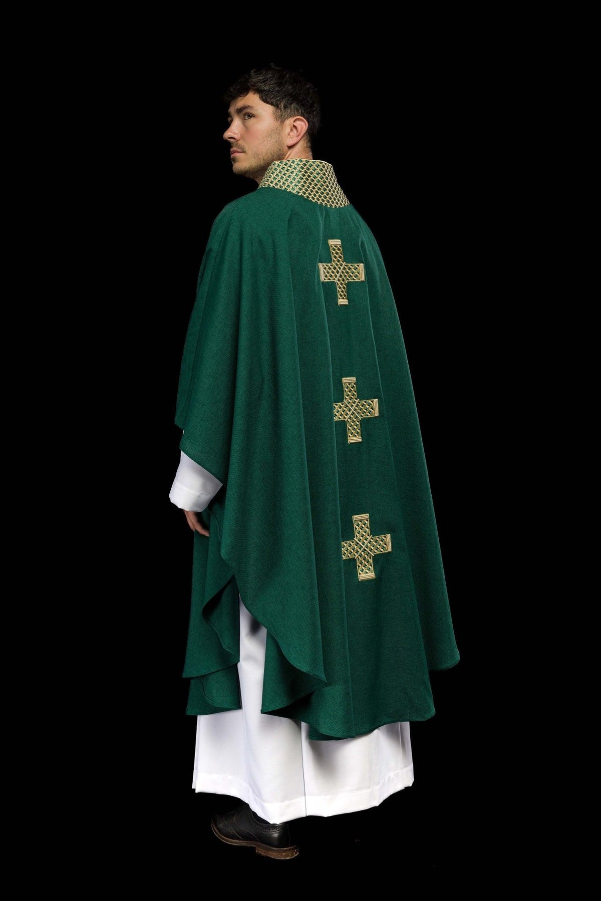 Green chasuble worn from the front with gold cross embroidery and collar