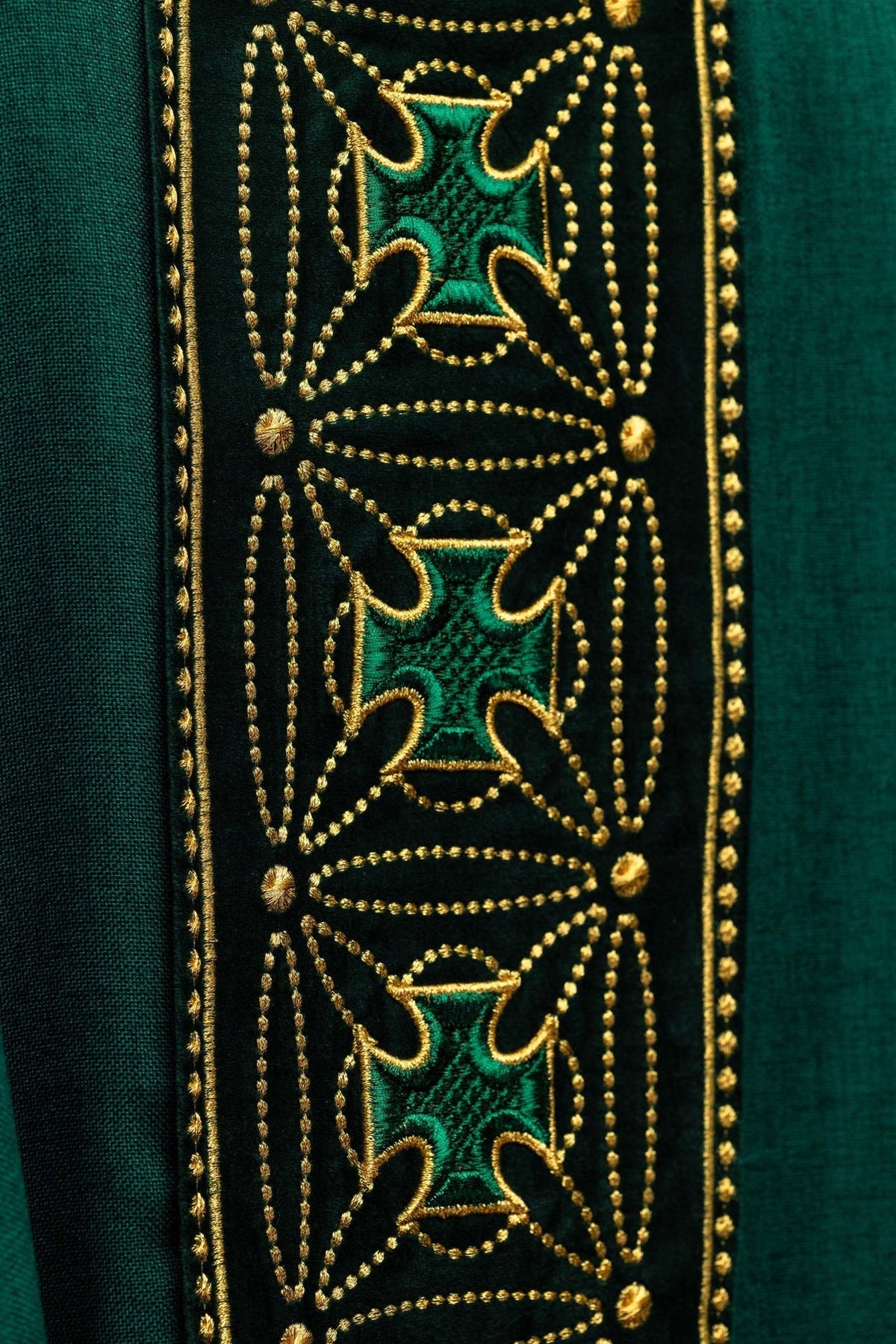 Green chasuble close-up of gold embroidered cross details on the orphrey