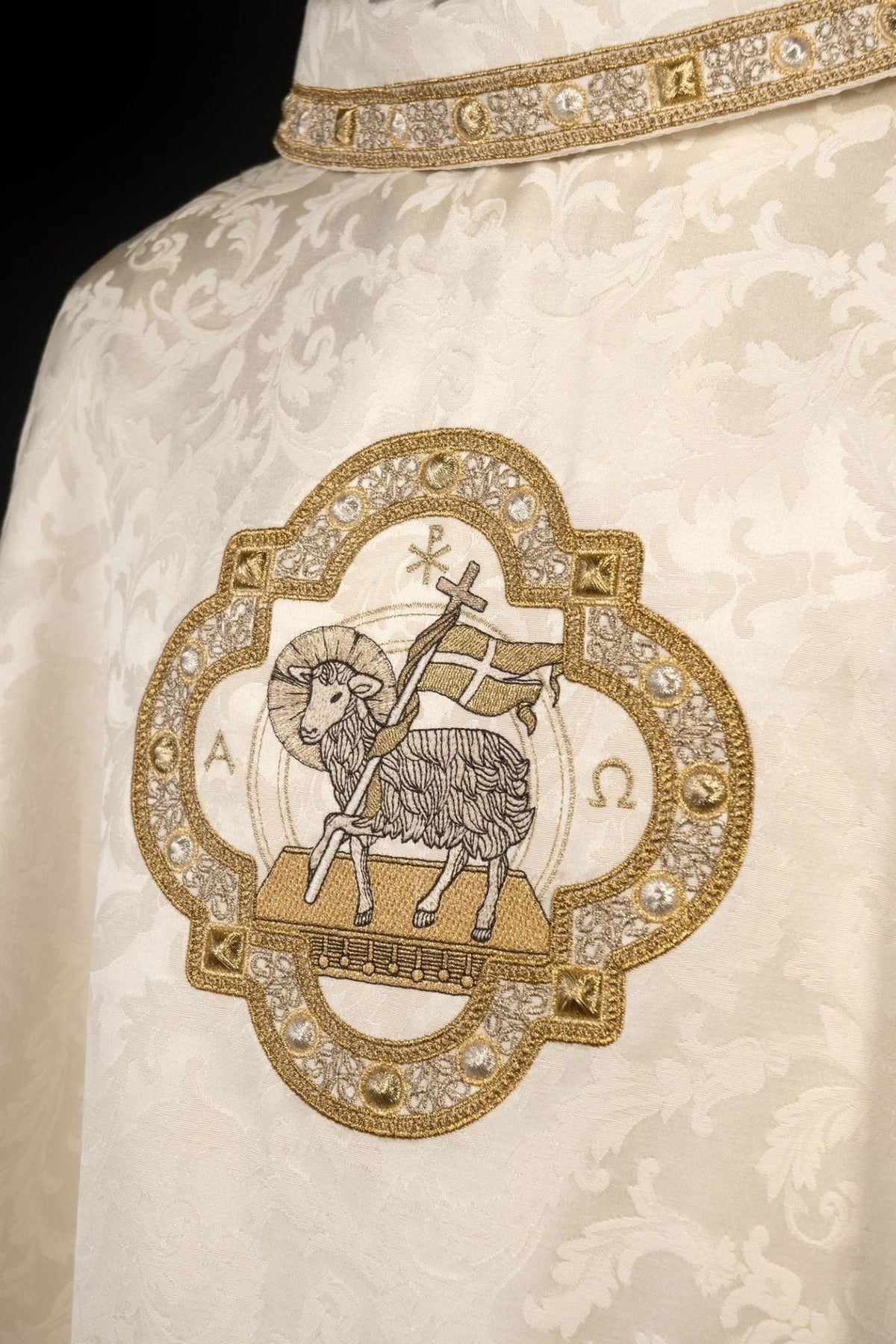 Close-up of Paschal Lamb embroidery on ecru chasuble