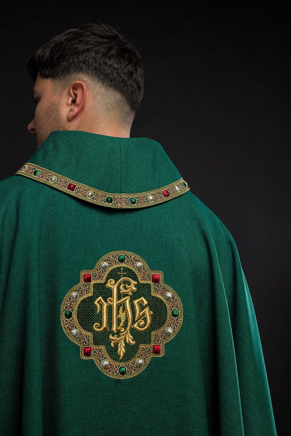 Green chasuble back view with IHS embroidery and matching collar trim