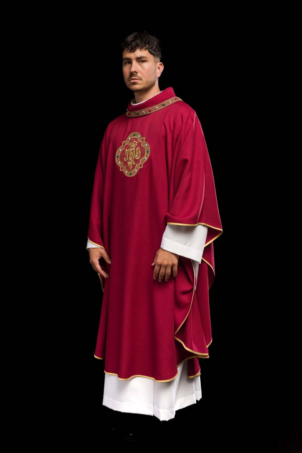 Red chasuble, side view showing gold trim, collar and IHS embroidery