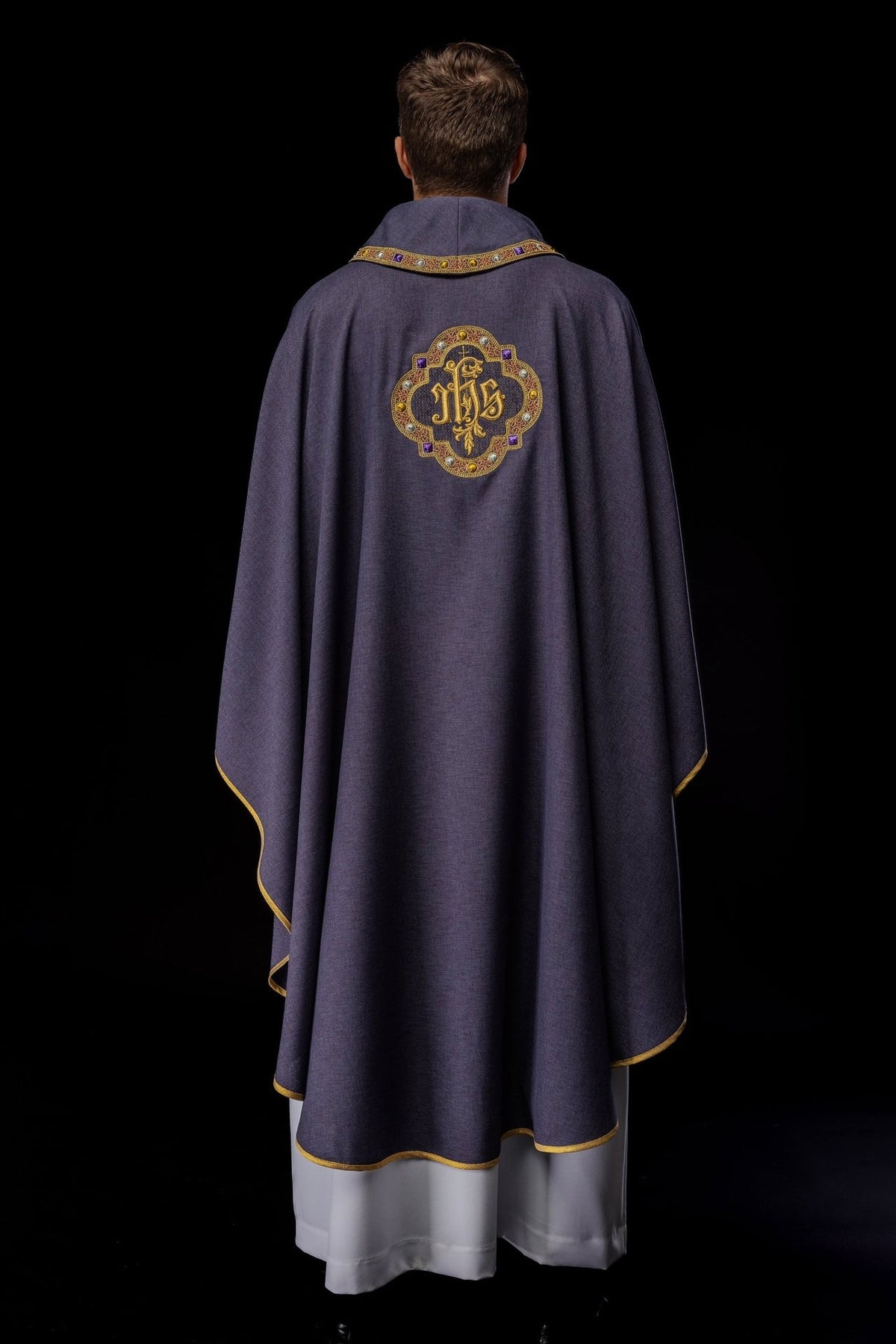 Purple chasuble back view with IHS embroidery and collar trim