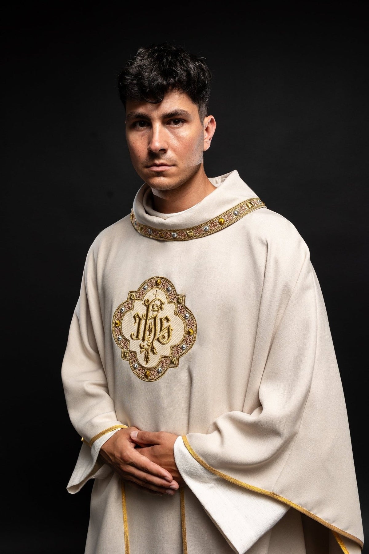 Ecru chasuble angled front view with IHS embroidery and gold trim