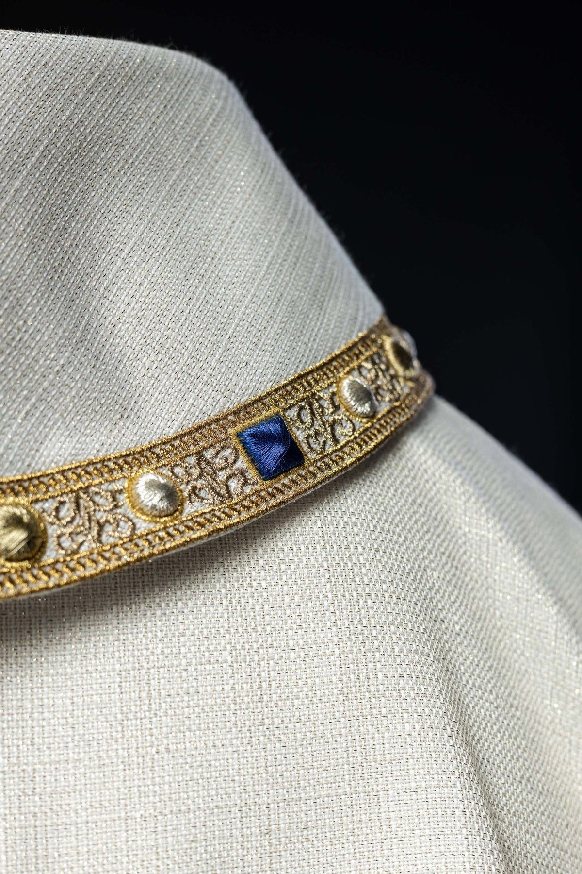 Liturgical chasuble close-up of gold galloon with blue and silver details