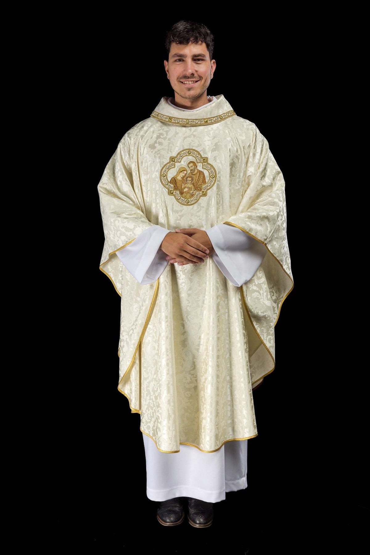 Embroidered Christmas Chasuble with an Image of the Holy Family, front view in ivory with gold trim