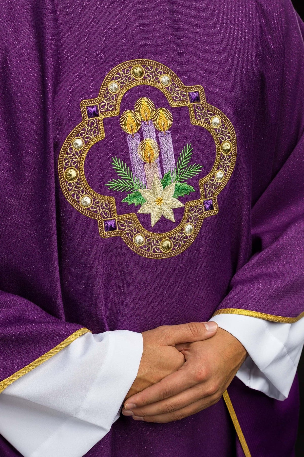 Purple chasuble close-up showing Advent candle and star embroidery