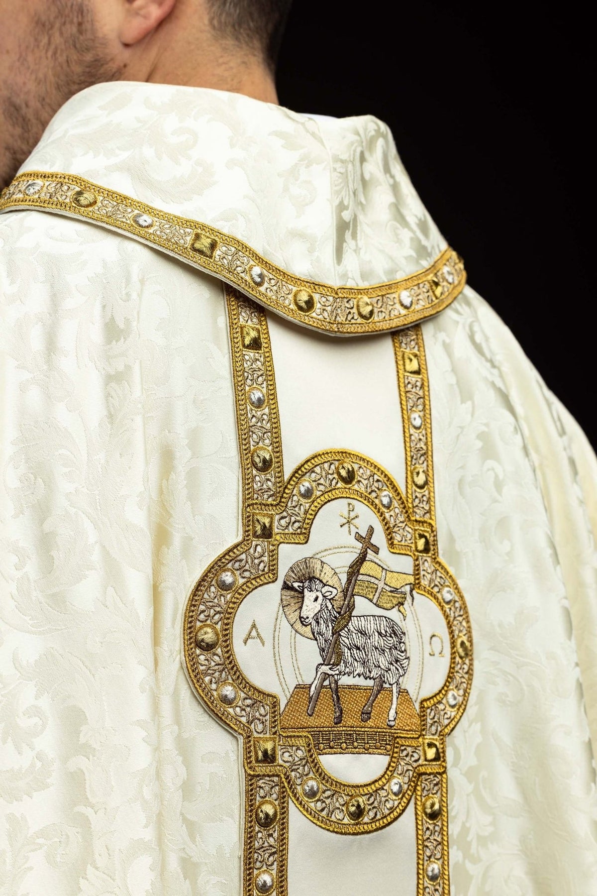 Ecru chasuble shoulder detail with jacquard fabric and gold embroidered trim