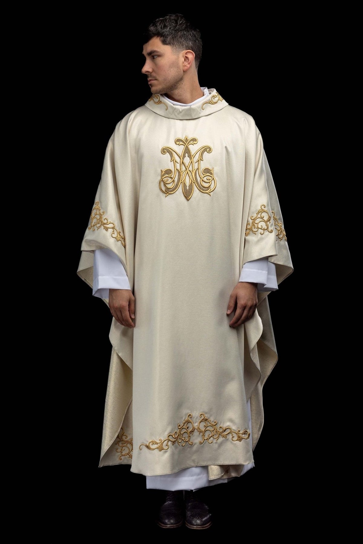 Marian chasuble front view with gold Marian symbol and hem embroidery