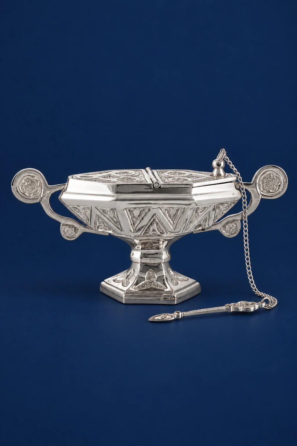 Nickel-Plated Brass Incense Boat with Incense Spoon, front view with embossed motifs and attached chain