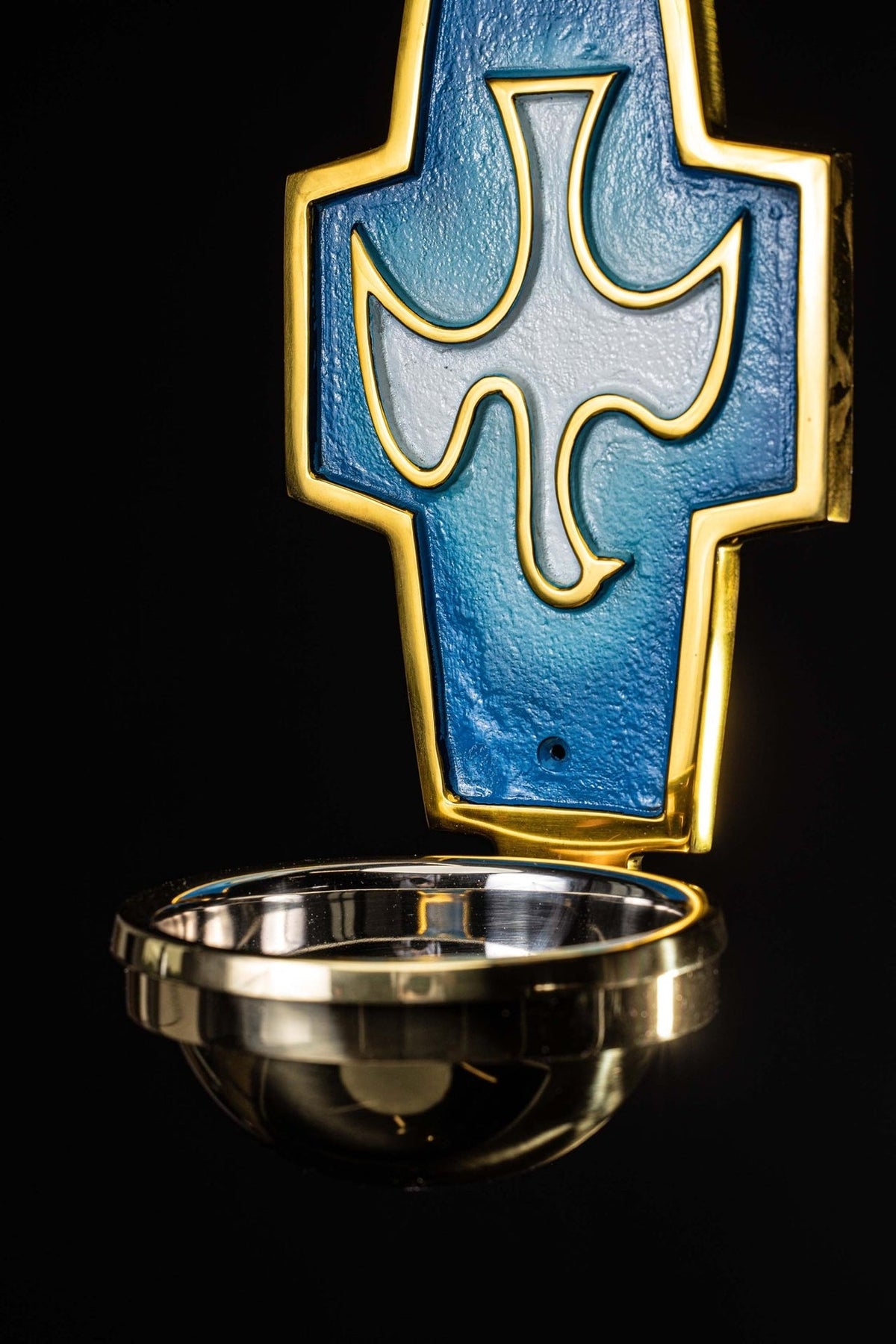 Holy water font angled view showing the blue panel, gold trim and metal basin