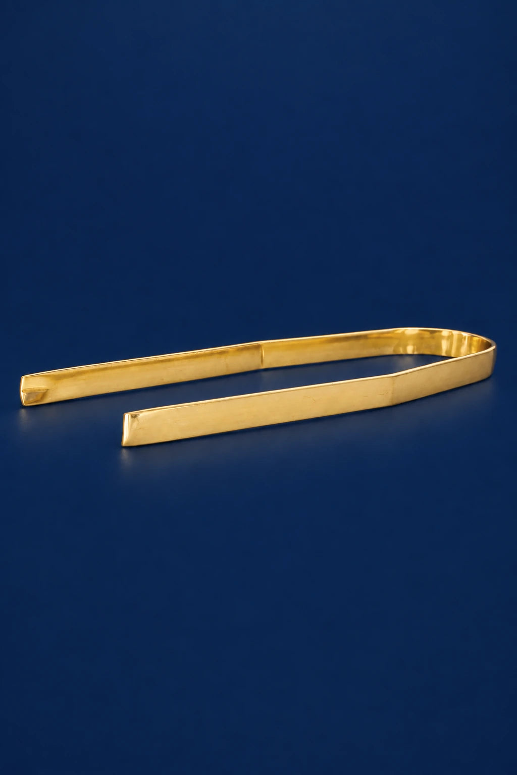 Brass charcoal tongs, 6.25 in (16 cm), shown open in a gold finish