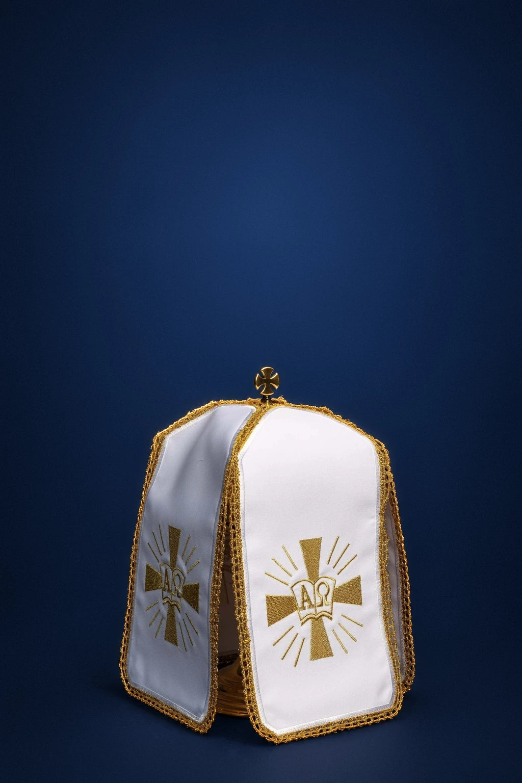 White ciborium veil with gold Alpha Omega embroidery, front view, draped over a ciborium