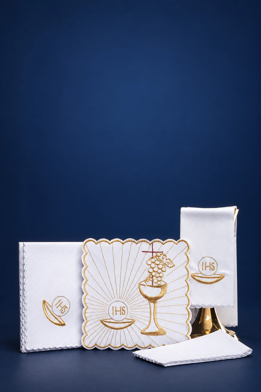 Altar linen set with Eucharistic embroidery: burse, pall, purificator, and corporal, shown front view