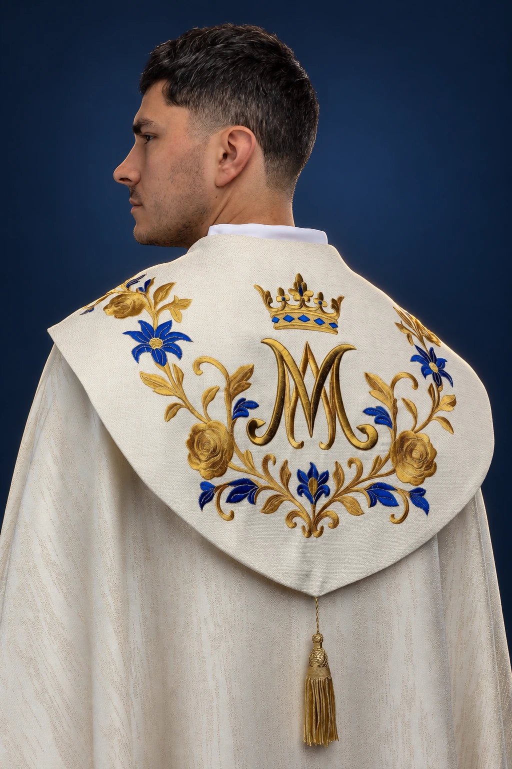 Back view of ecru cope with Marian monogram embroidery and gold tassel clasp
