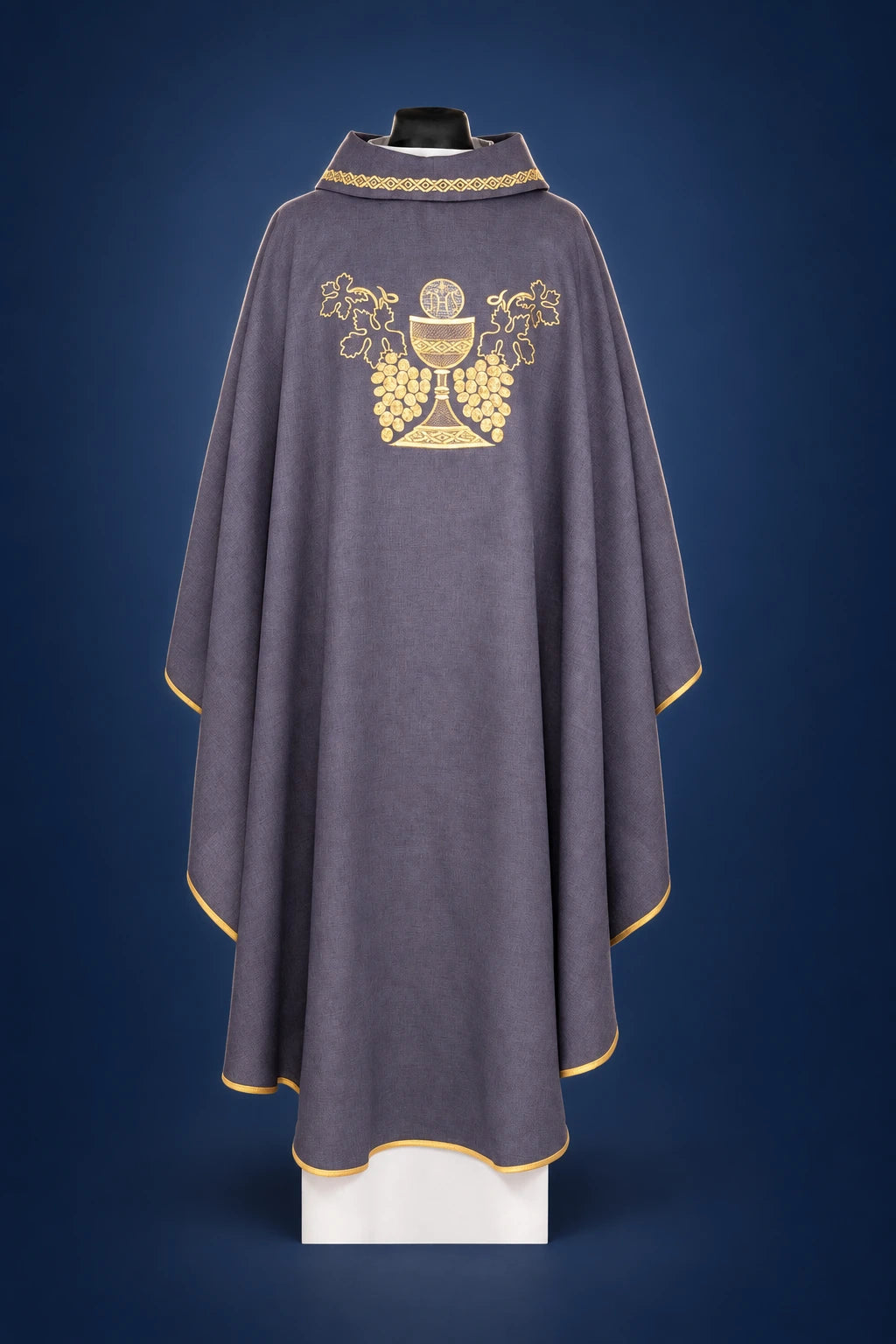 Back view of a purple chasuble with gold trim and chalice-and-grapes embroidery on the yoke