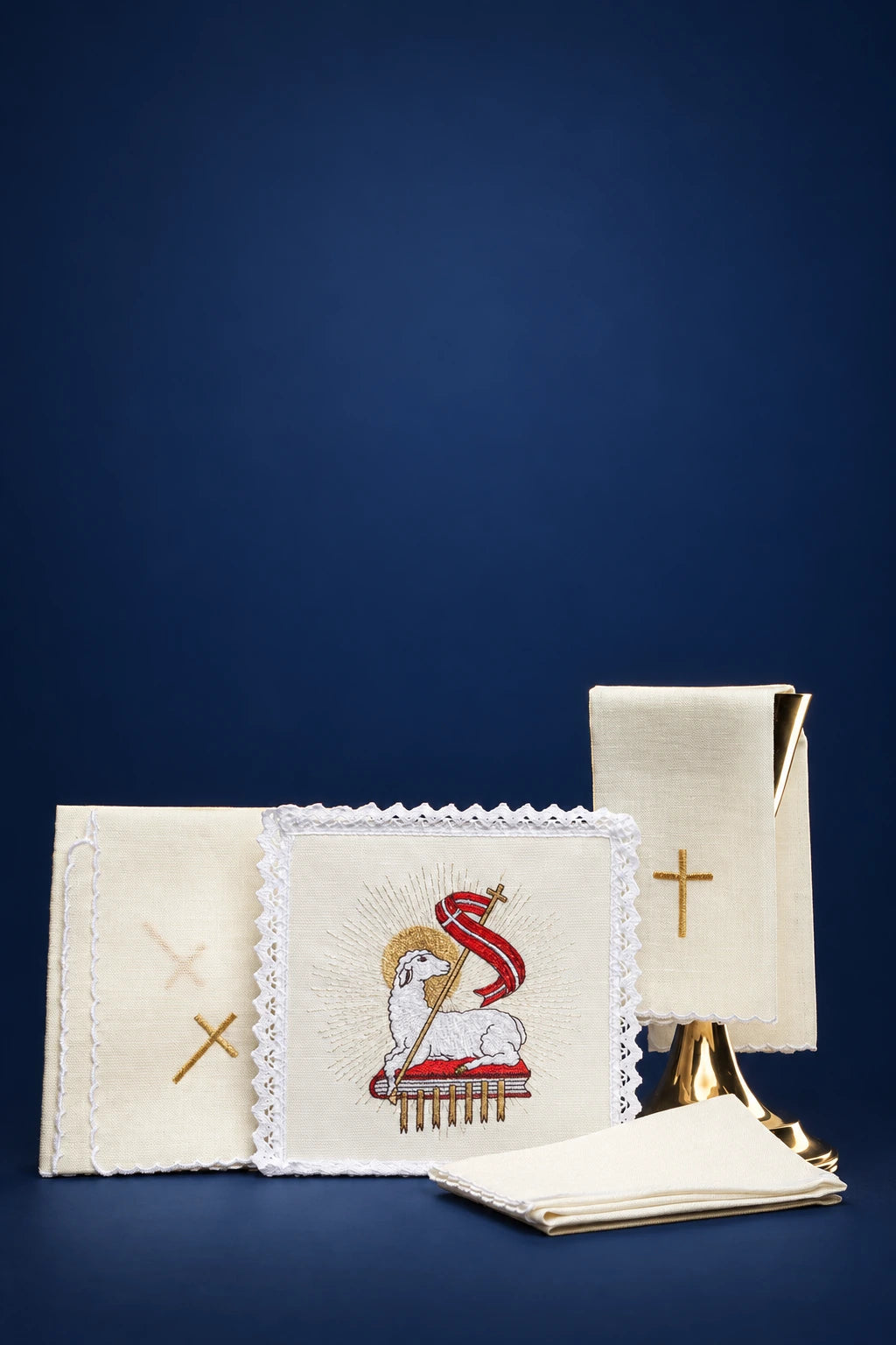 Catholic altar linen set with embroidered Agnus Dei, unfolded cloths and folded purificator shown front view