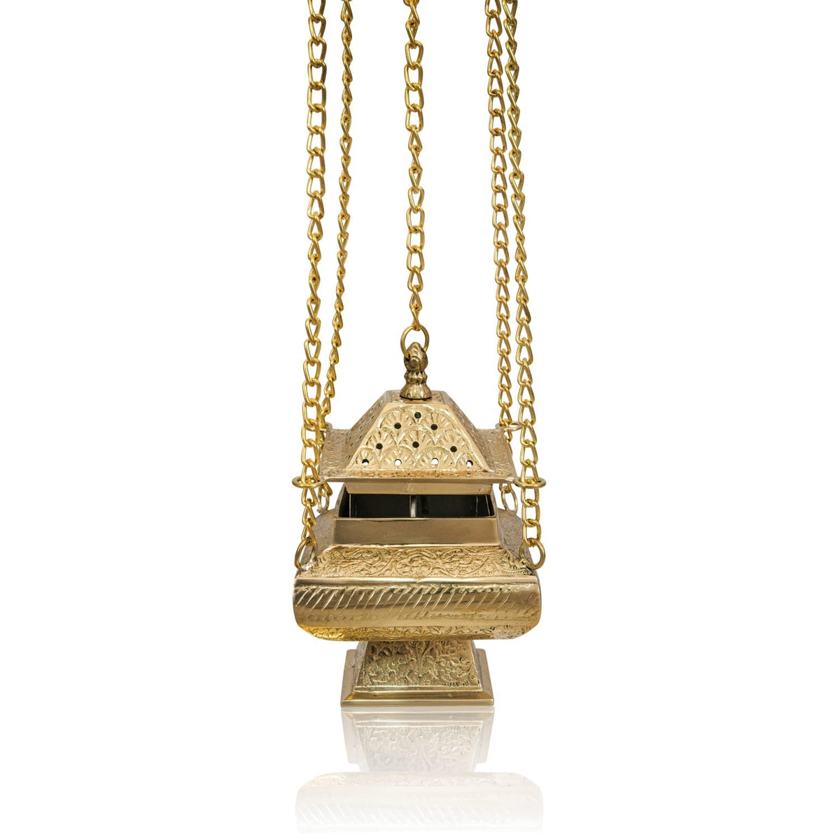Brass thurible shown hanging, revealing its perforated lid, engraved body and long chains