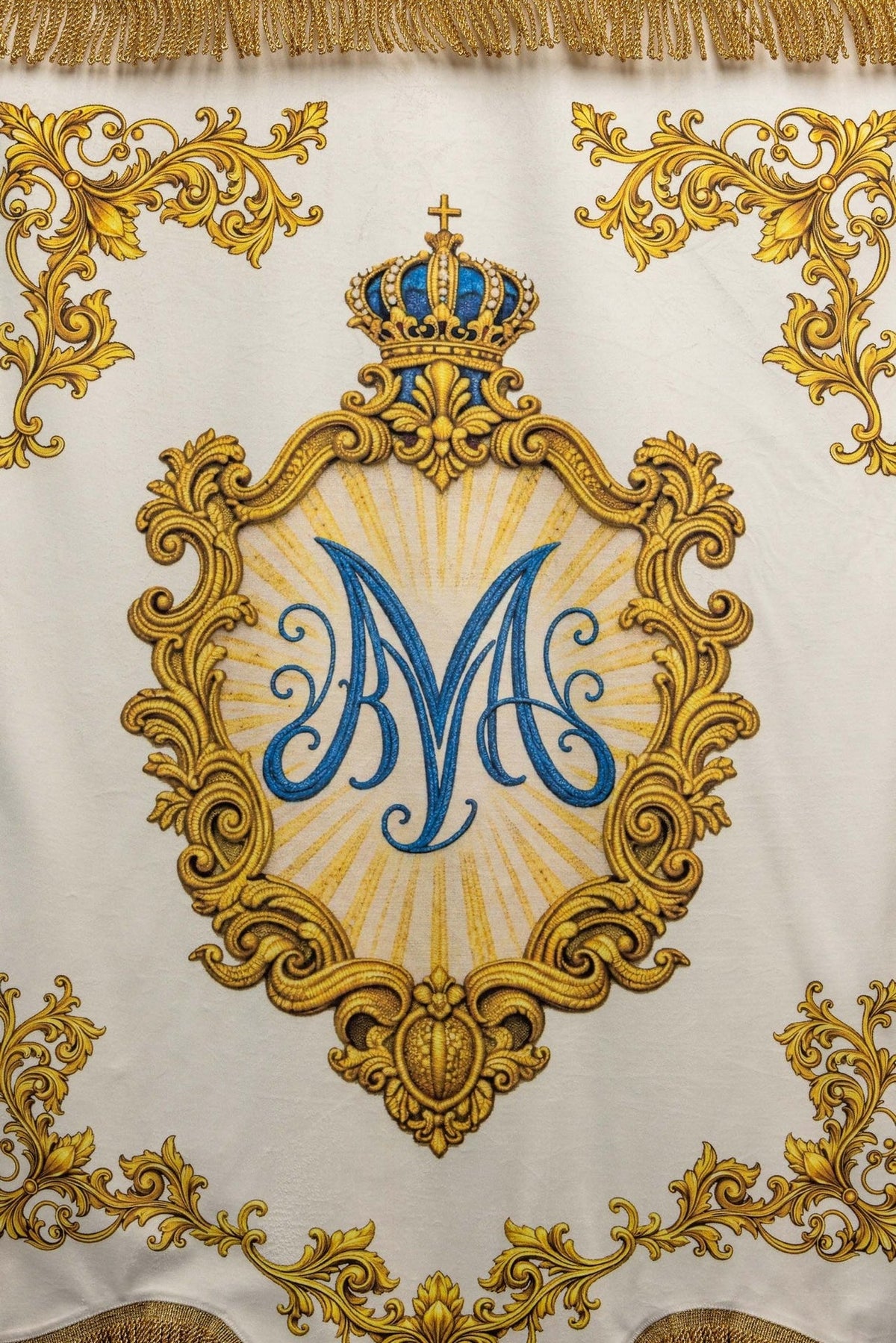 Church banner lower edge with gold fringe and scrollwork