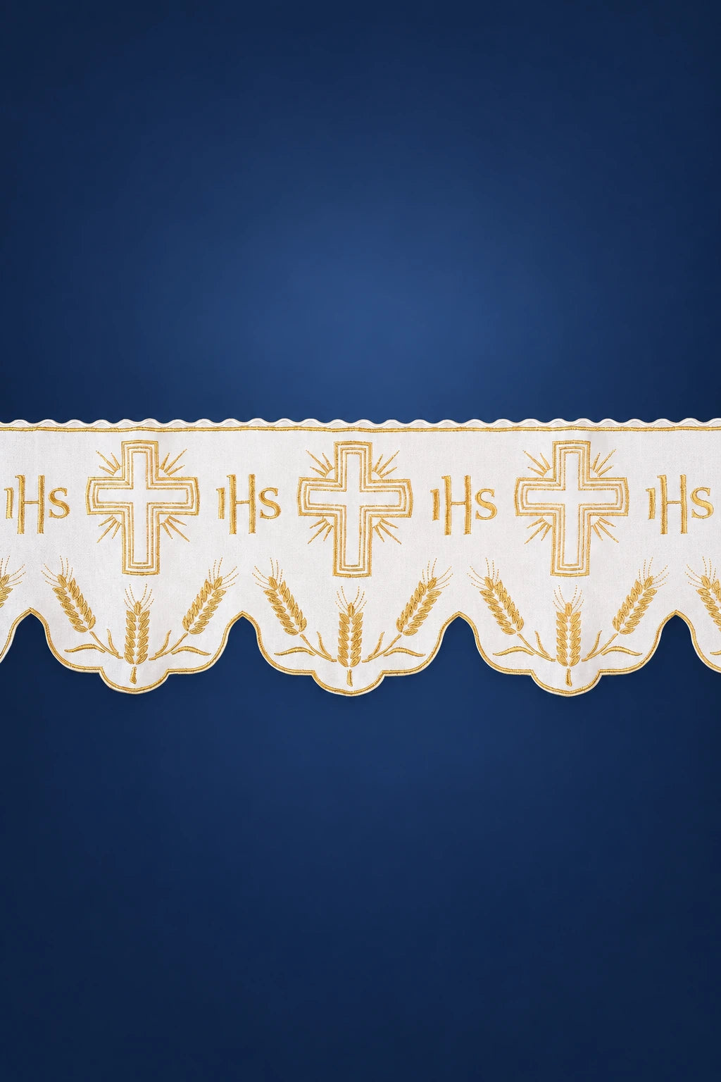 Close-up of ecru altar lace with IHS monograms, crosses, and scalloped wheat motif