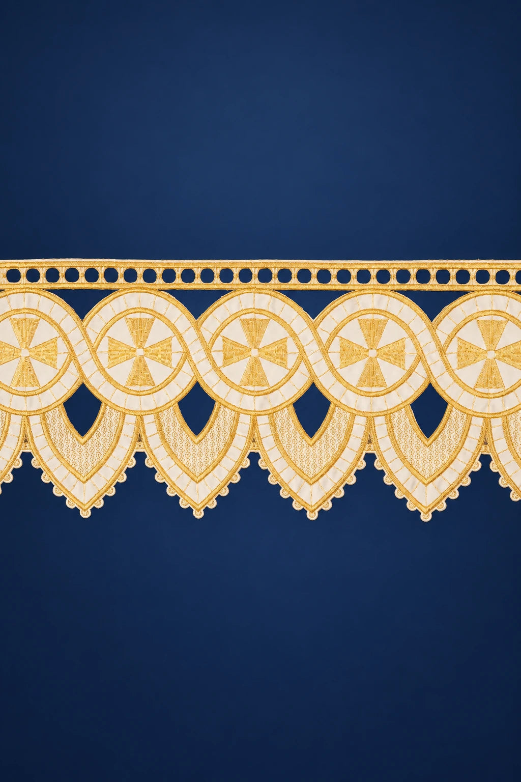 Close-up of ecru altar lace trim with embroidered crosses and scalloped edge