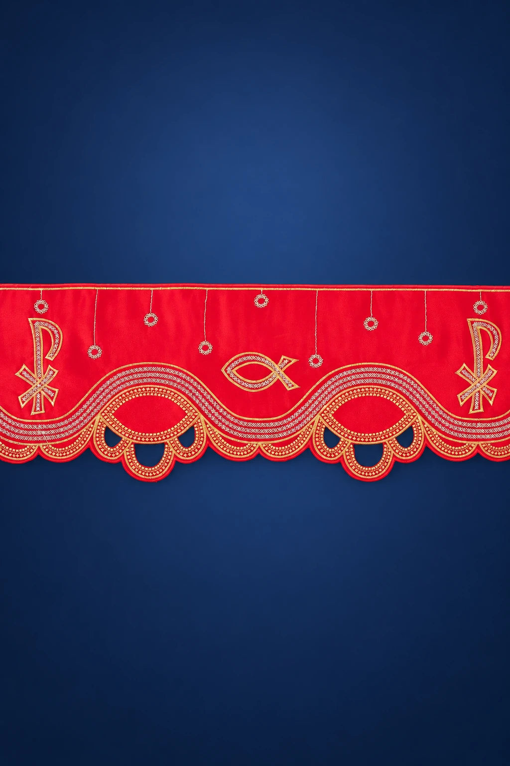 Close-up of red altar lace with scalloped edge embroidery, PAX symbol and fish motifs