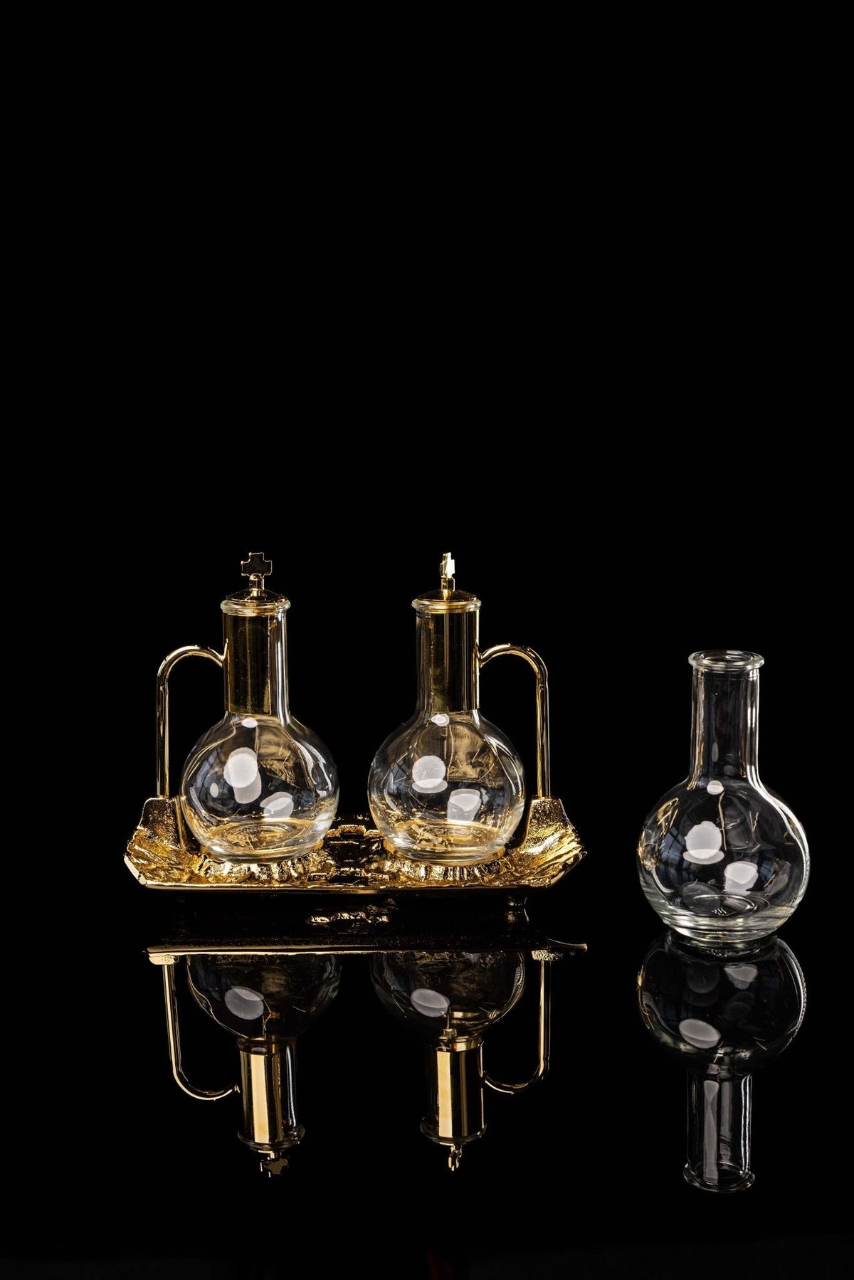 Cruet set with gold-plated tray, front view showing two cruets and a separate glass bottle