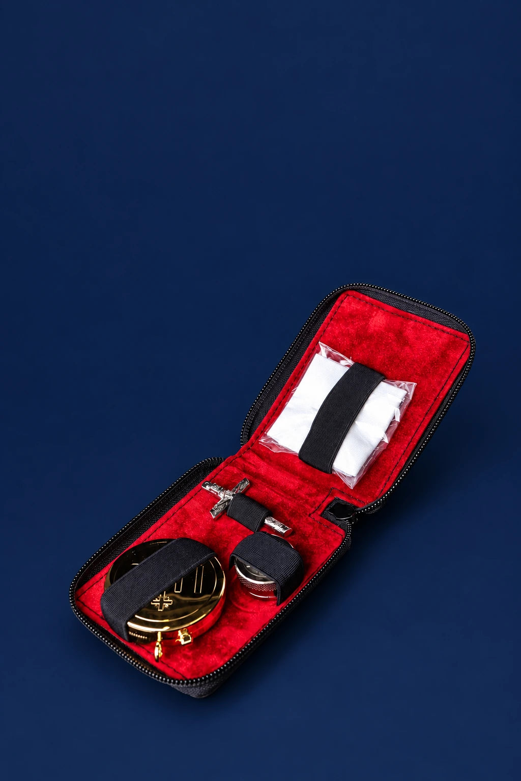 Burse with Liturgical Supplies in a Hard Case open, showing red lining, white linens, metal vessels and cross
