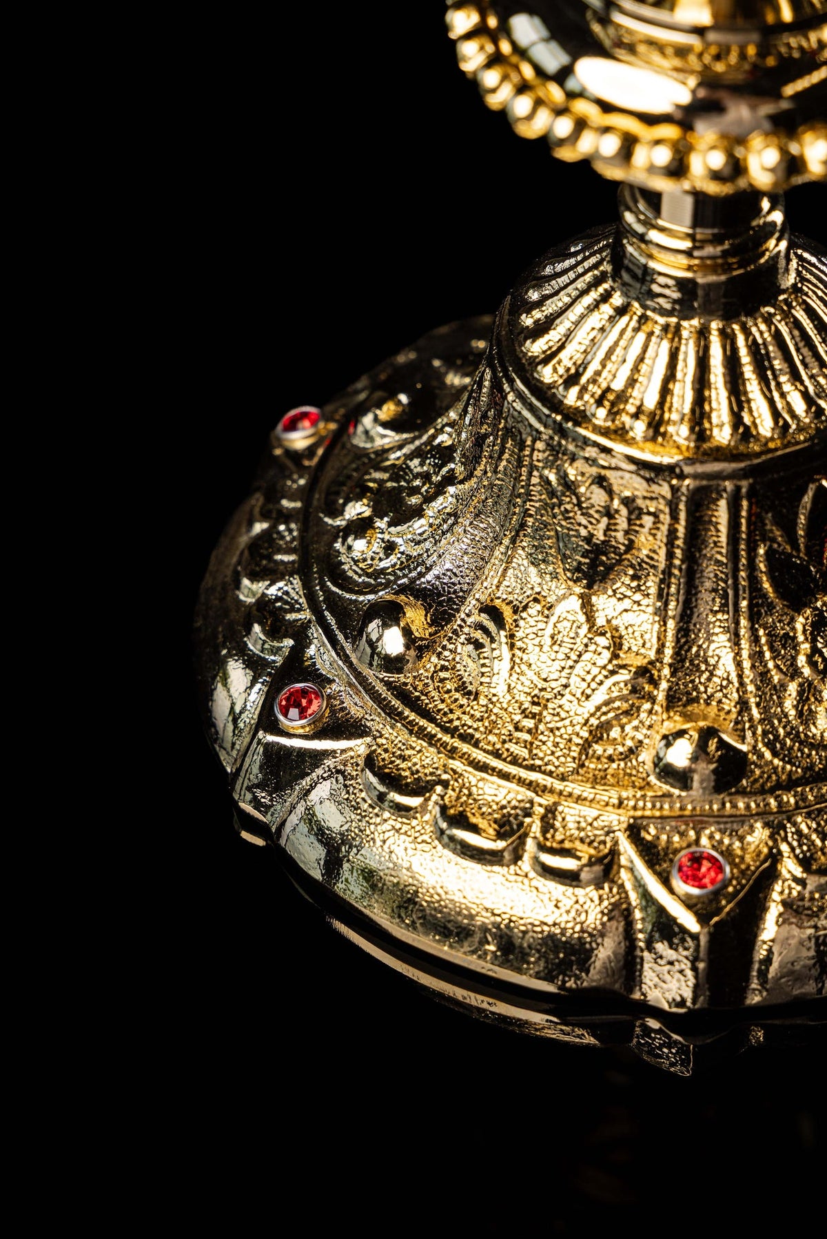 Gold-plated chalice base with ornate relief and imitation rubies