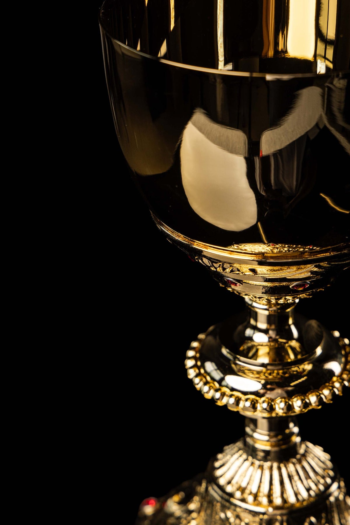 Gold-plated chalice cup and stem with ornate relief