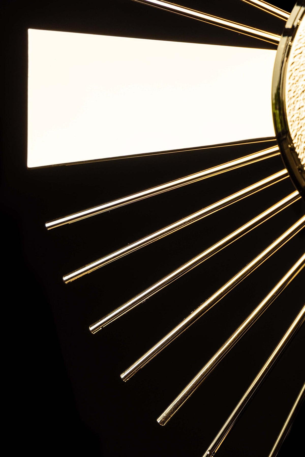 Gold-plated brass monstrance close-up of the cross motif and radiating rays