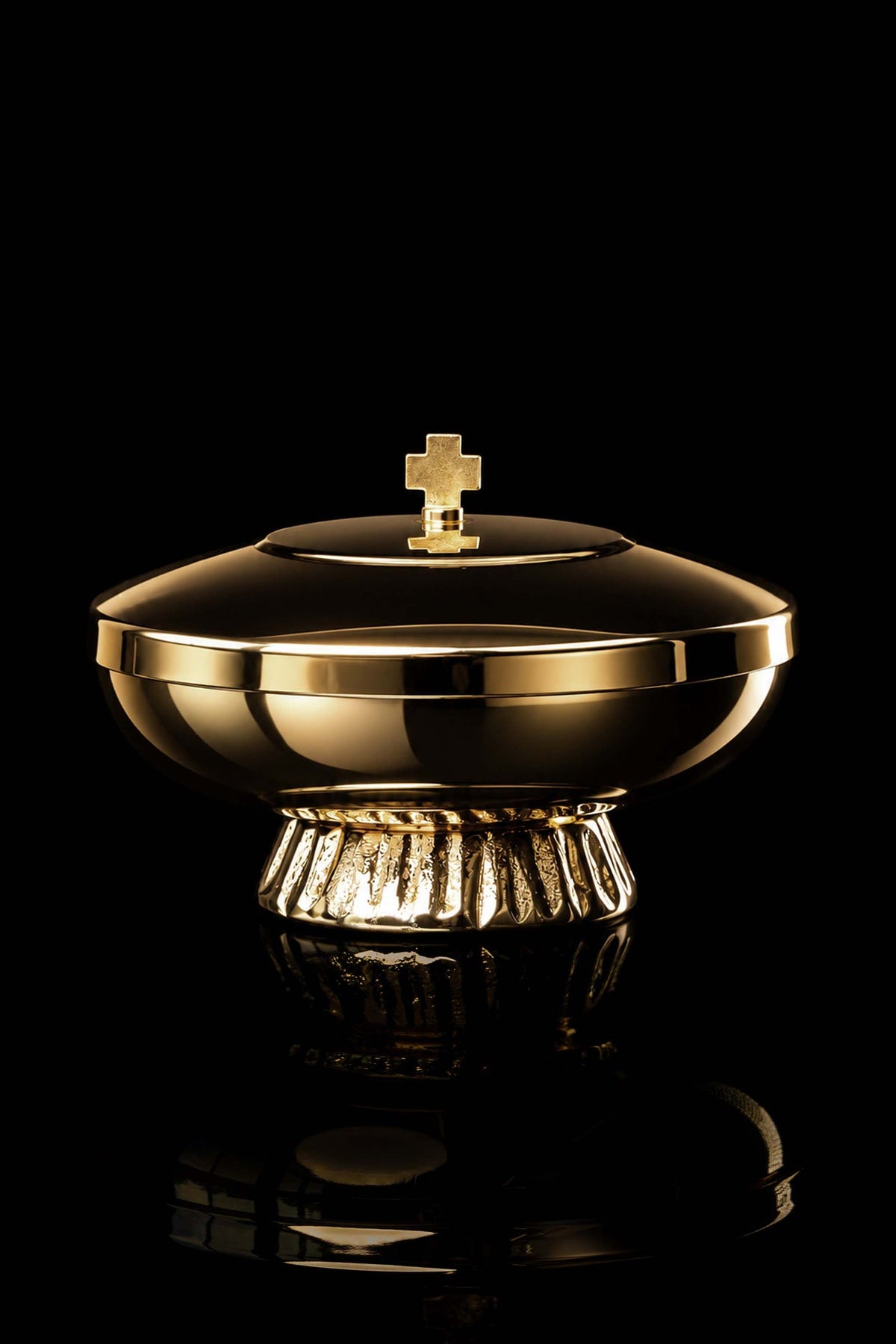 Gold-plated brass ciborium, front view showing cross finial and polished rim