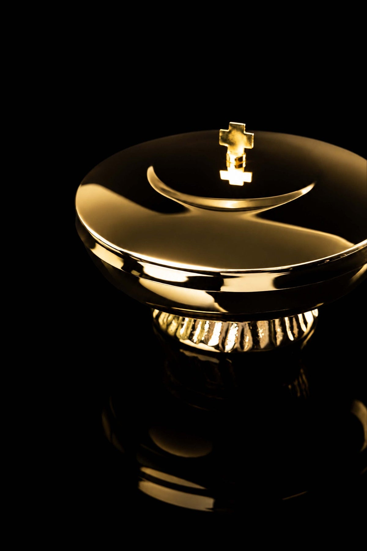 Gold-plated brass ciborium, angled view showing lid, rim, and fluted base