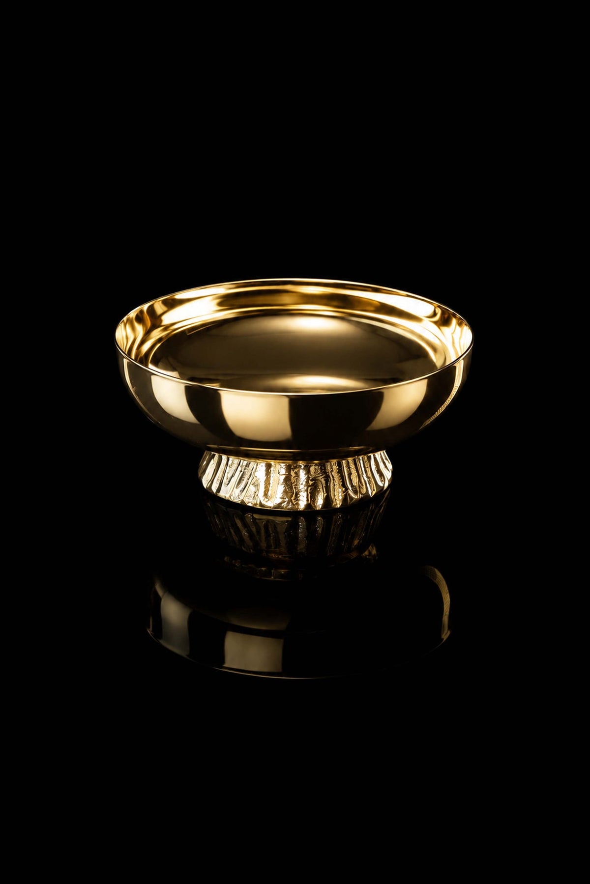 Gold-plated brass paten, angled front view showing raised rim and fluted foot