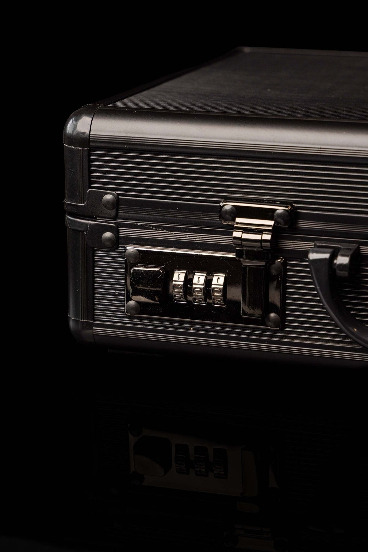 Liturgical equipment case close-up showing black ribbed exterior and combination lock