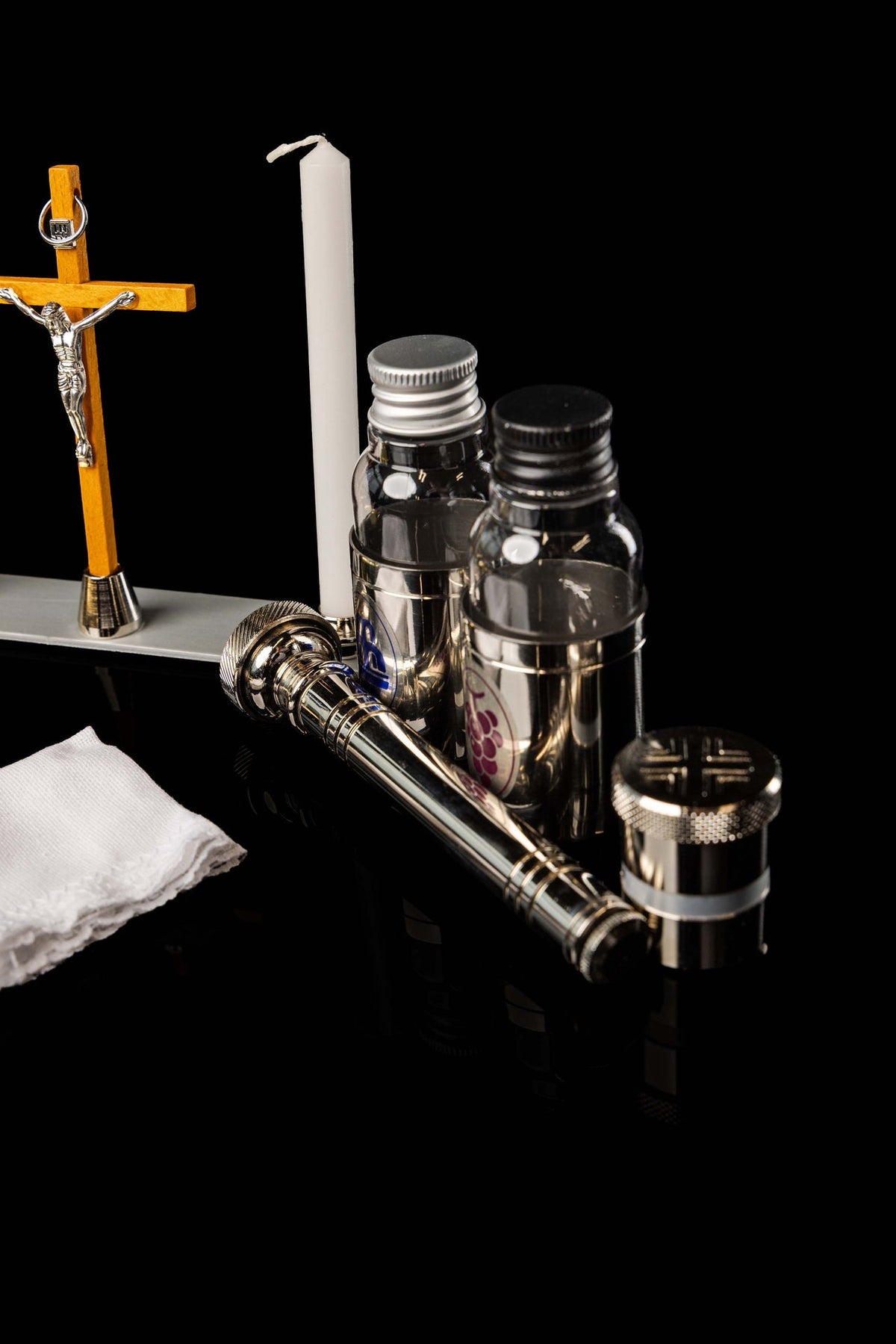 Liturgical Equipment Suitcase with Small Altar shown open with crucifix, candle, bottles and vessels
