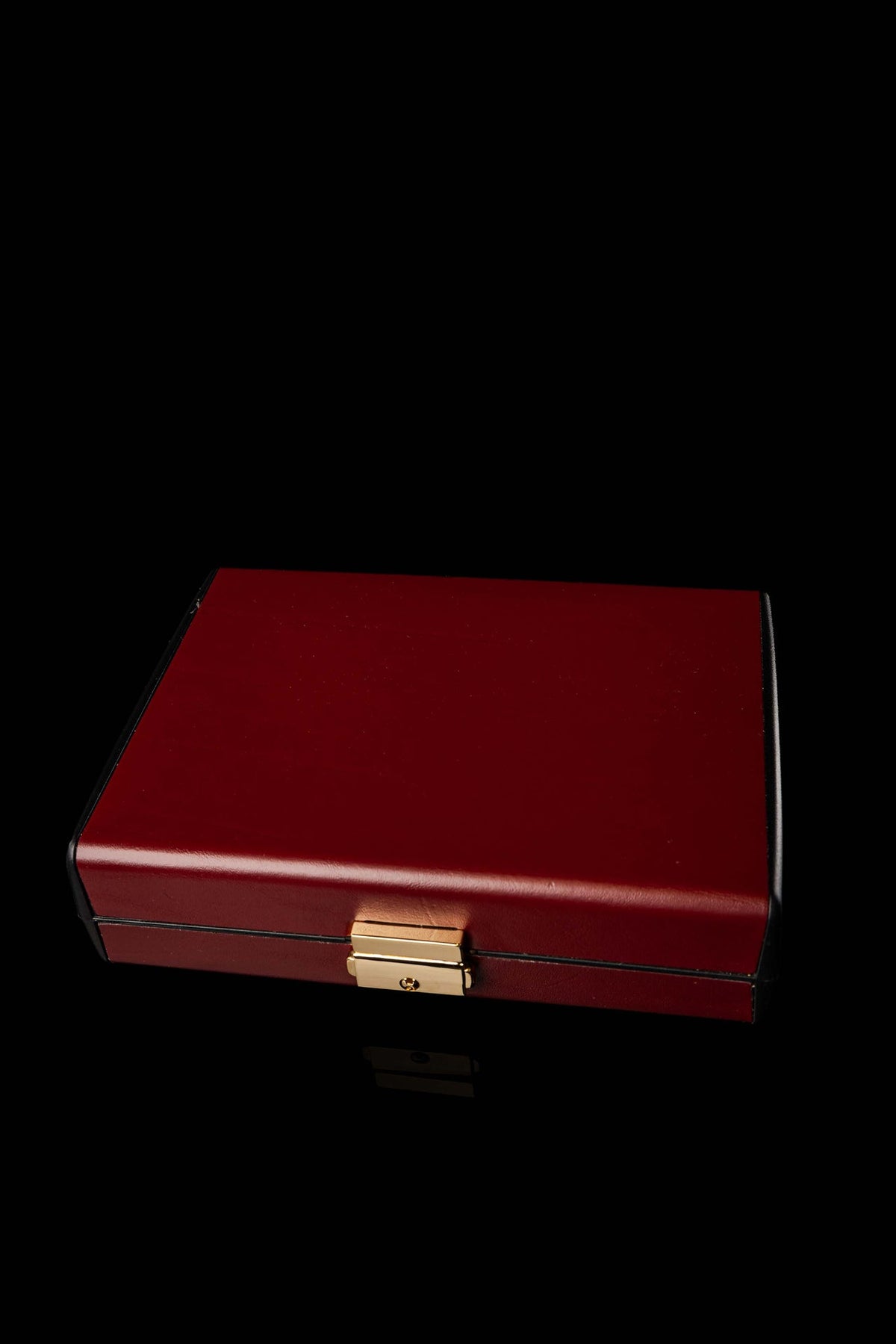 Liturgical Equipment Suitcase with Small Altar closed in burgundy with gold clasp