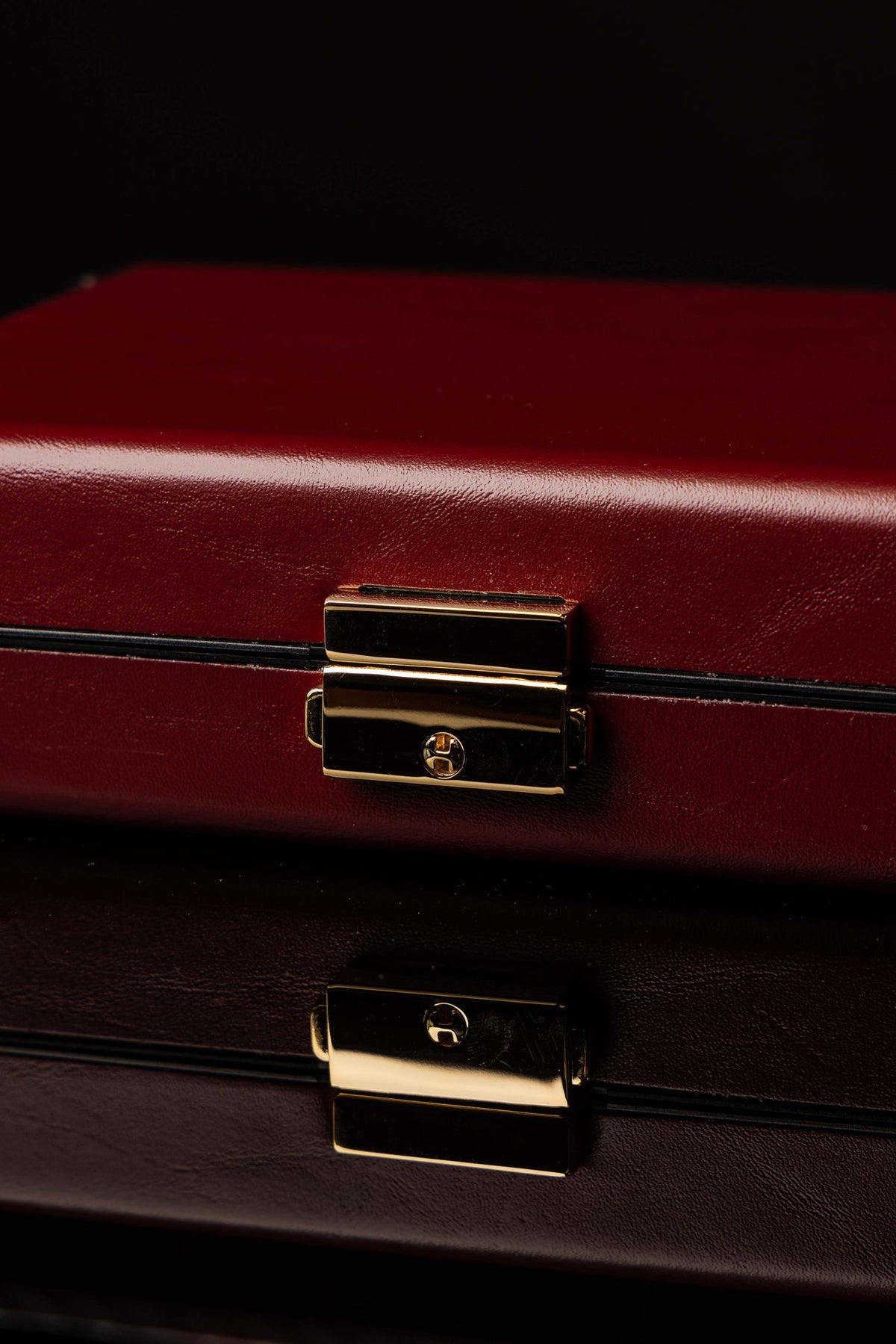 Liturgical Equipment Suitcase with Small Altar close-up showing burgundy surface and gold clasp