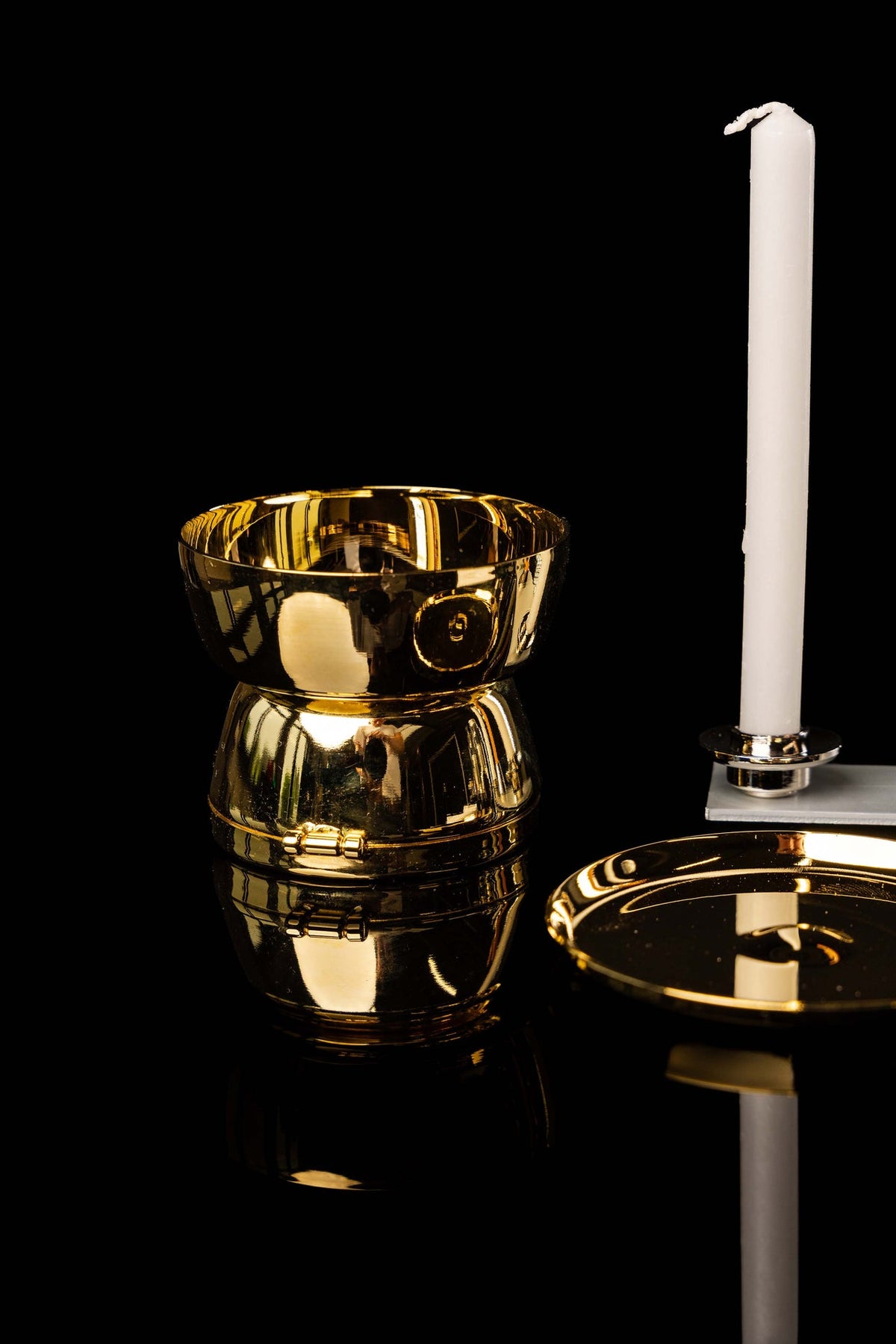 Gold vessel and candle from the liturgical equipment suitcase