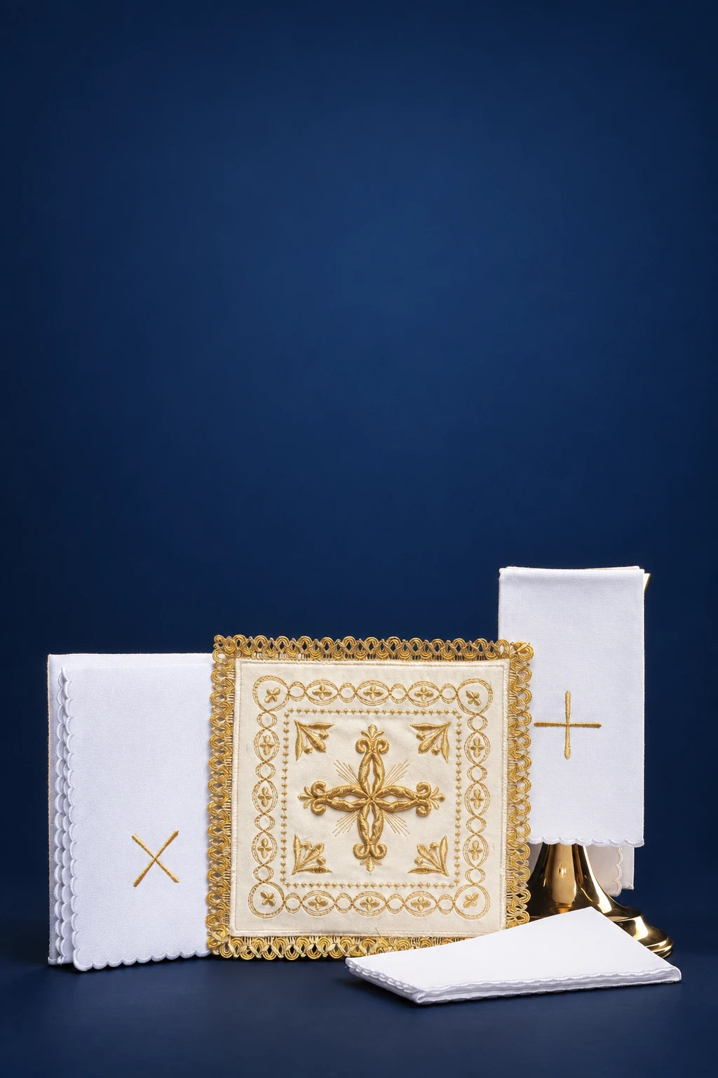 Ecru altar linen set with gold cross motifs and lace trim, shown laid out flat and folded