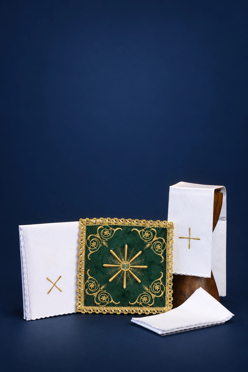 Embroidered green velvet altar linen set with gold cross and starburst motifs, front view arranged together