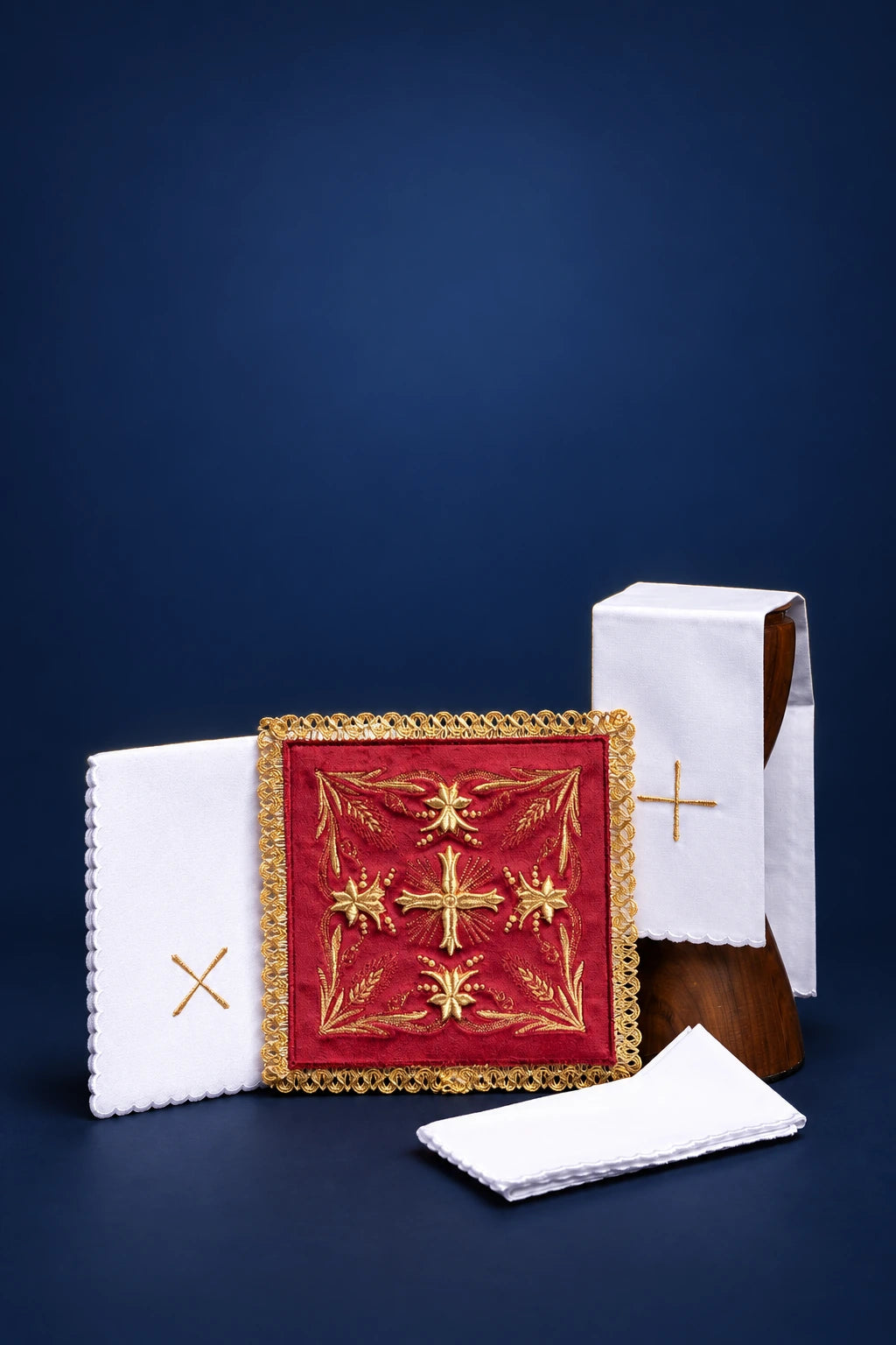 Embroidered red velvet altar linen set with gold cross motif and white linens with gold crosses
