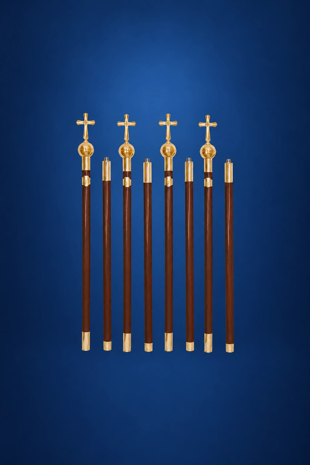 Four dark canopy poles with gold cross finials and gold bands, arranged upright in a front view.